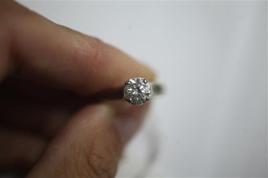 A modern 14ct white gold and solitaire diamond ring, size K/L.
